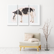 black and white cow and frenchie canvas art