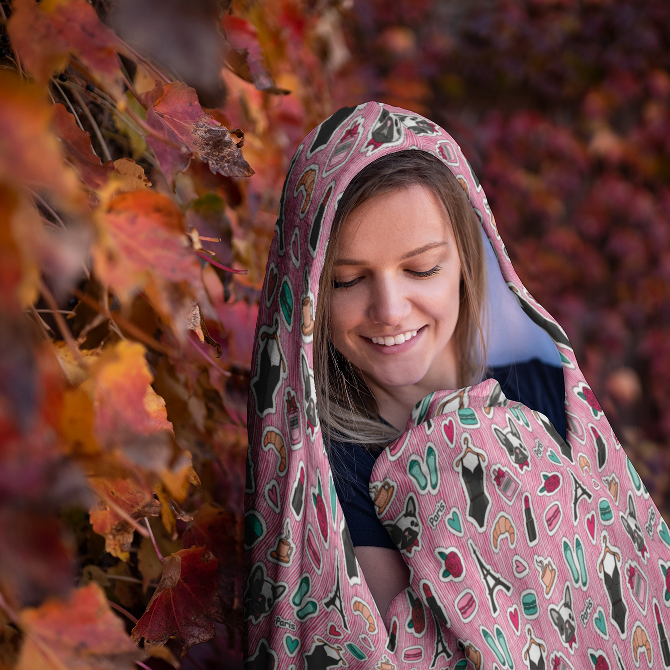 girl wearing hooded blanket french bulldog pattern